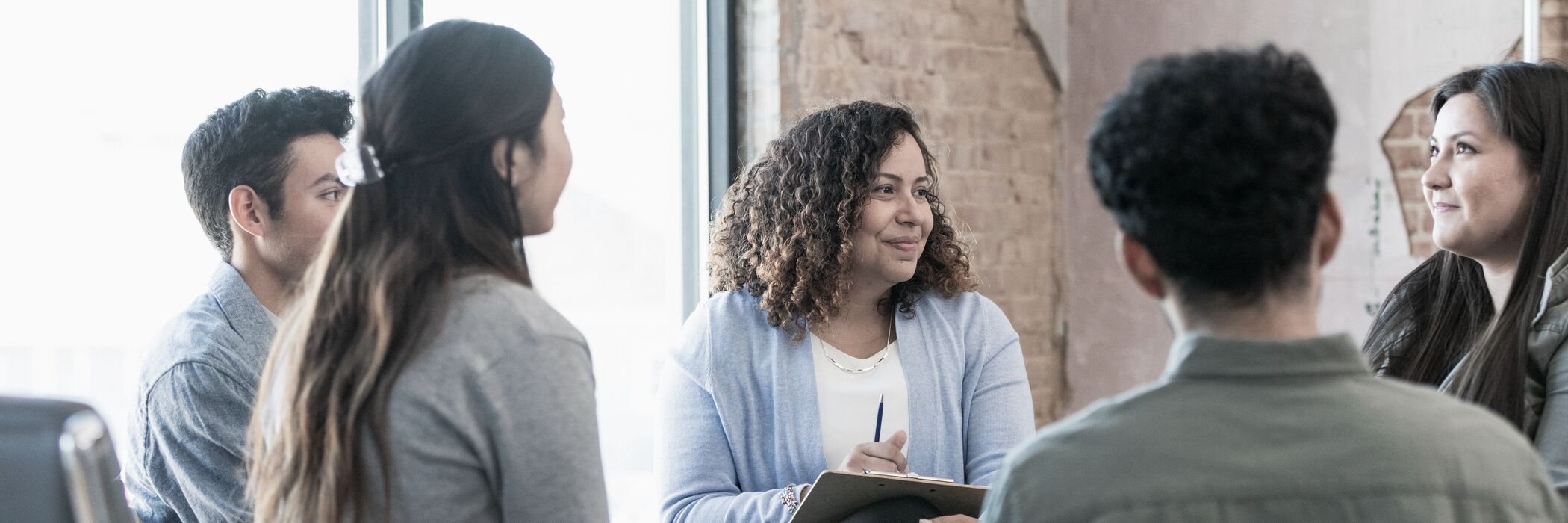 A therapist discussing outpatient treatment programs at Pillars Health Group.