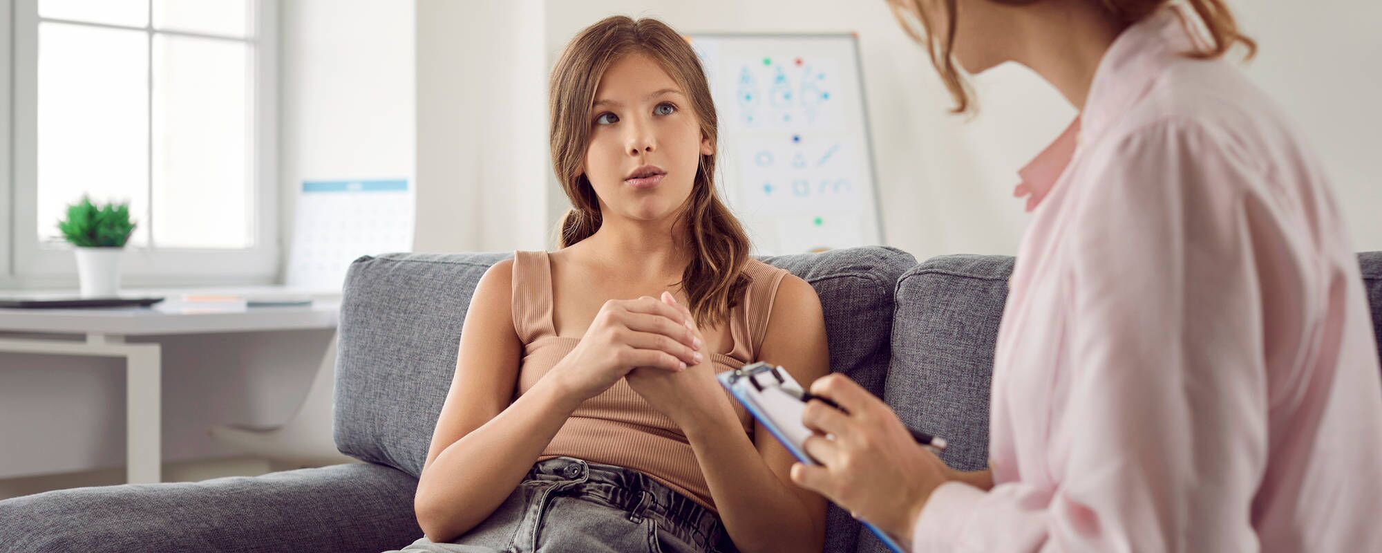 A young girl in teen outpatient treatment for an eating disorder. She's being helped at Pillars Health Group's Concord, MA location.