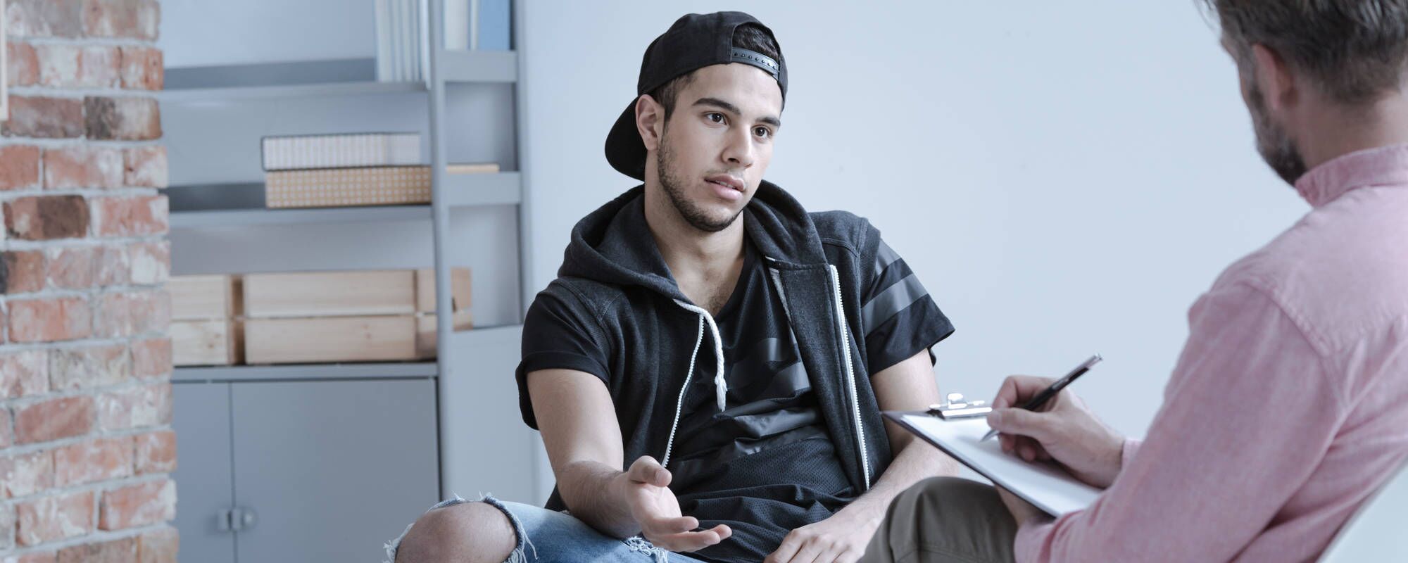 A young teen boy in an individual therapy session for teen OCD treatment at Pillars Health Group in Concord, MA.