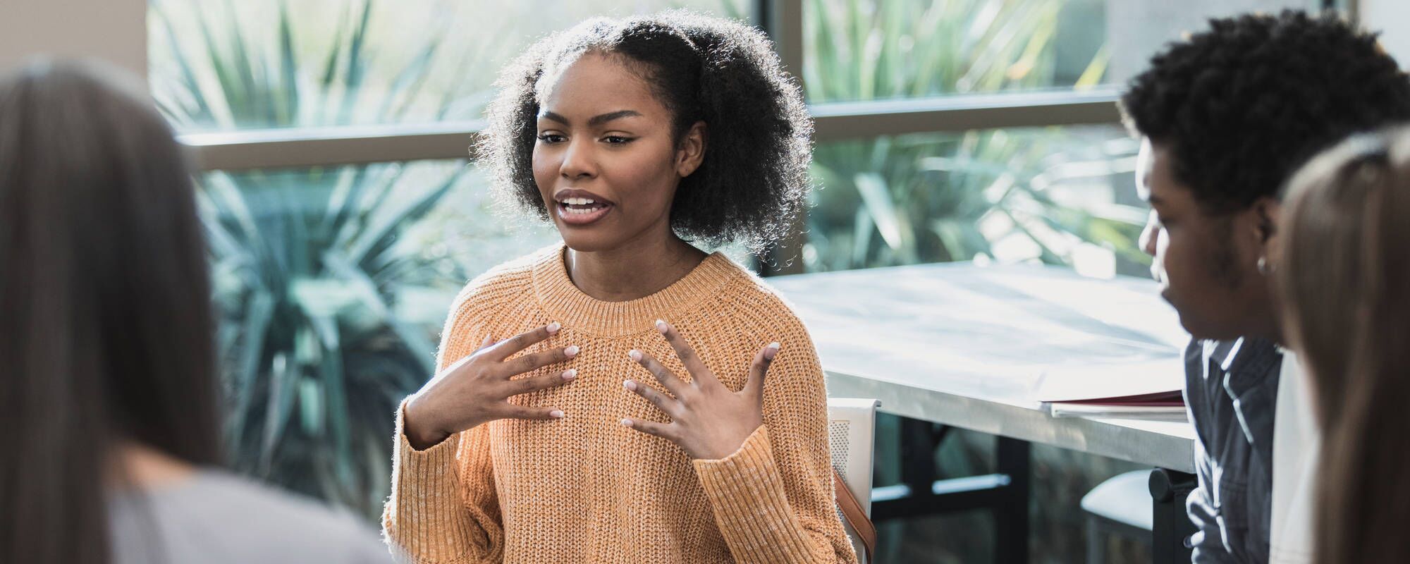 A young girl in a group therapy session for teen mental health treatment at Pillars Health Group in Concord, MA.