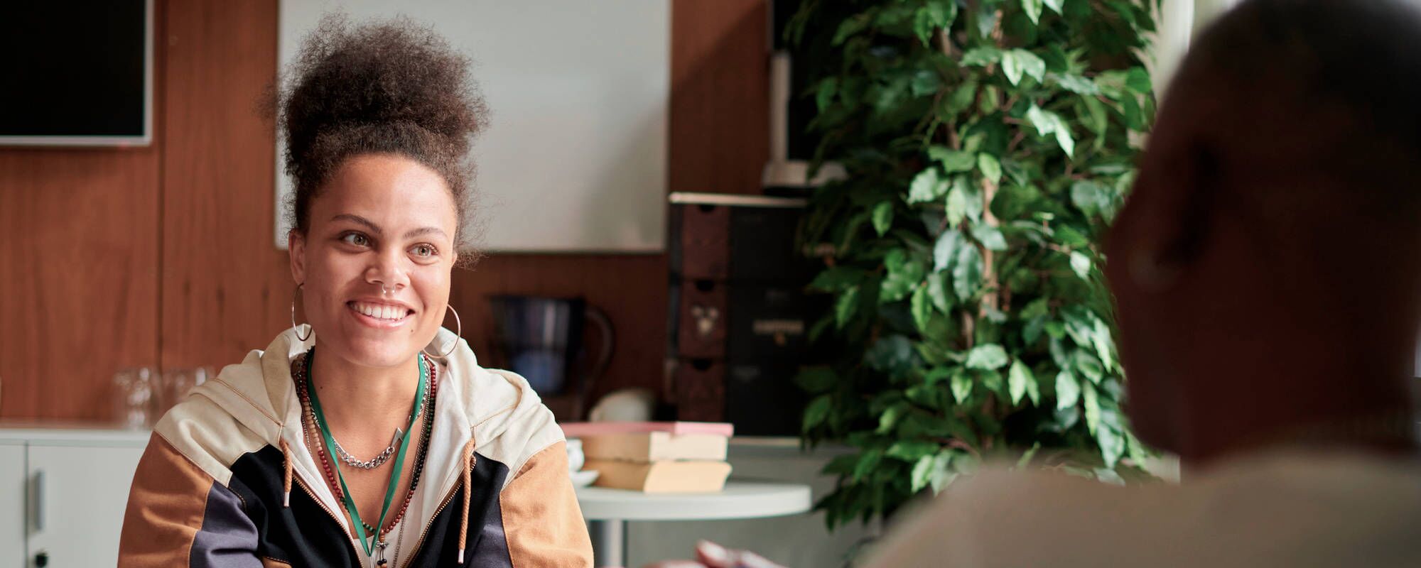 A young woman in a therapy session for teen body dysmorphia treatment at Pillars Health Group in Concord, MA.