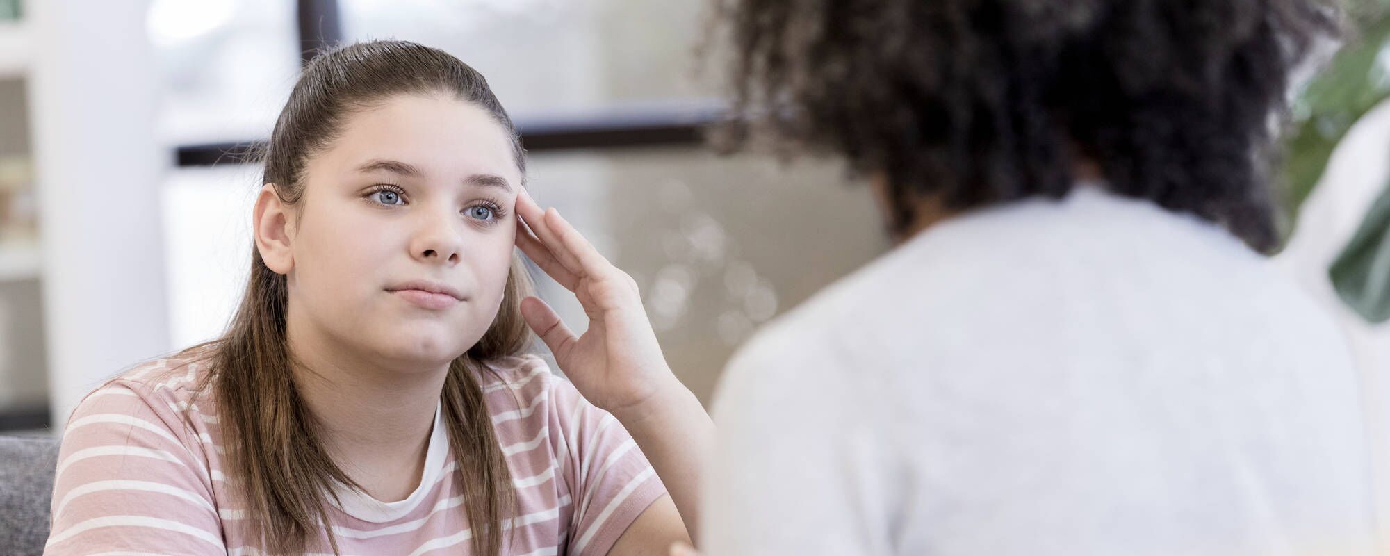 A young girl in an individual therapy session for teen anxiety disorder at Pillars Health Group's adolescent mental health center in Concord, MA.